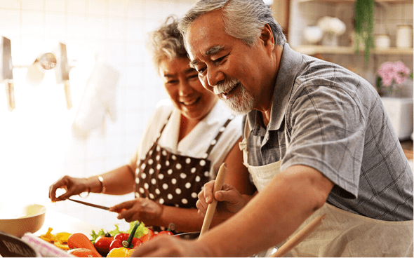 Happy pair enjoying kitchen time
