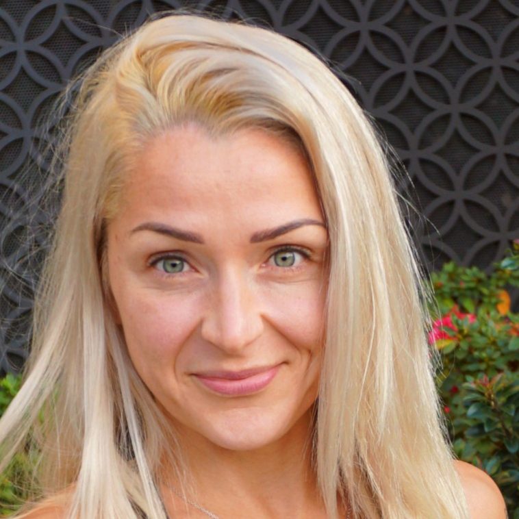 Smiling woman with long blonde hair