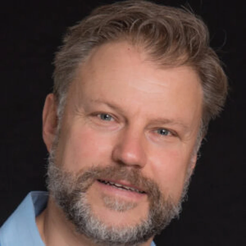 Smiling man on dark background