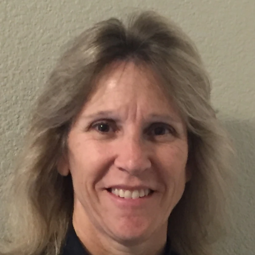 Woman with shoulder-length hair smiling