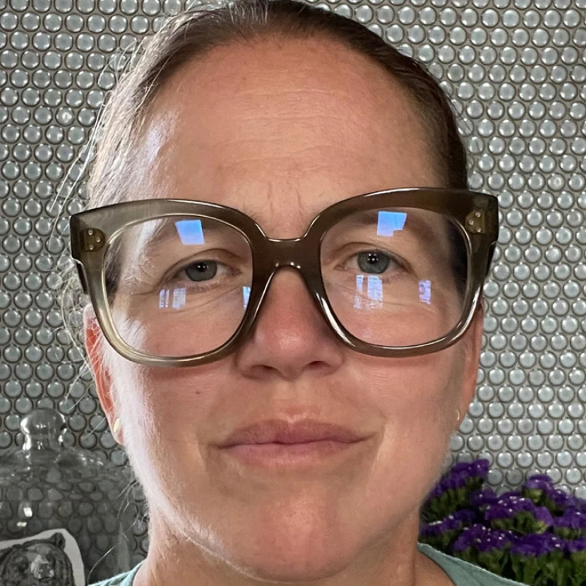 Close-up of woman with clear eyeglasses