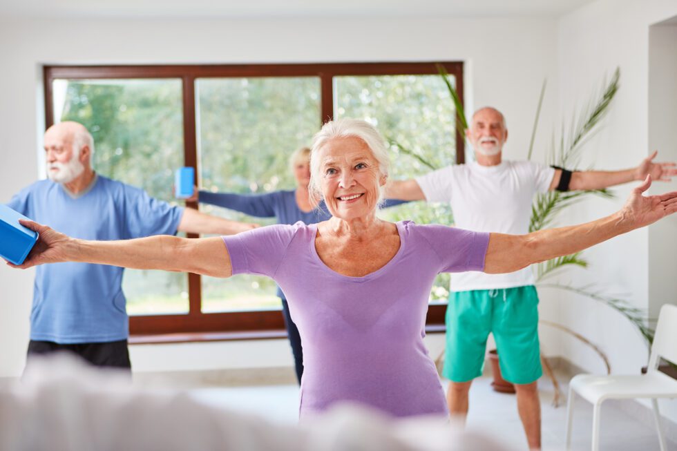 Seniors exercising with hand weights