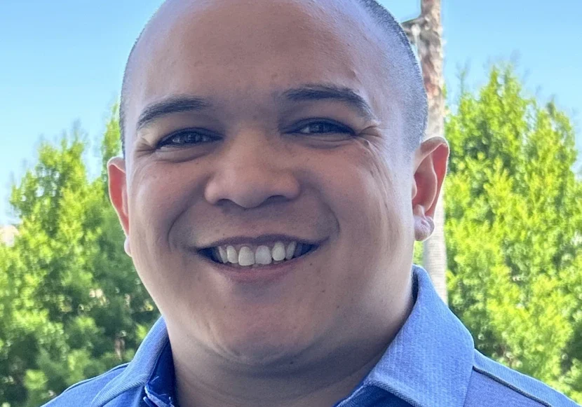 Happy individual with blue shirt