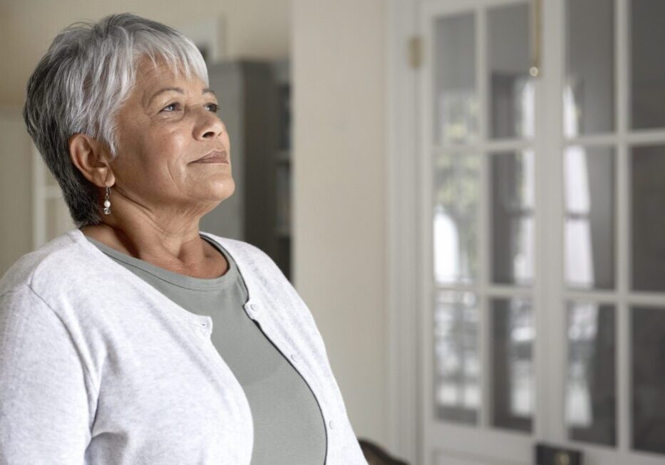 Mature woman standing in a room