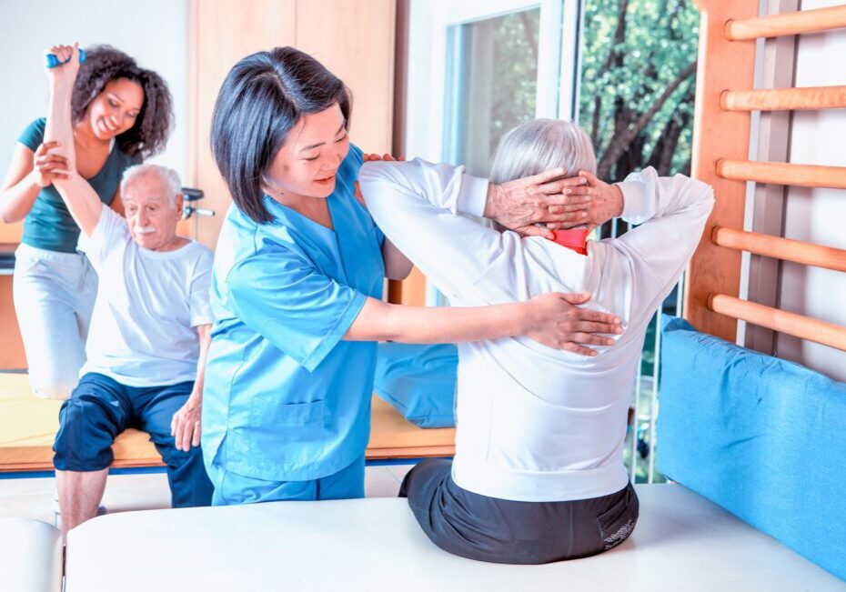 Caregivers assisting seniors with exercises
