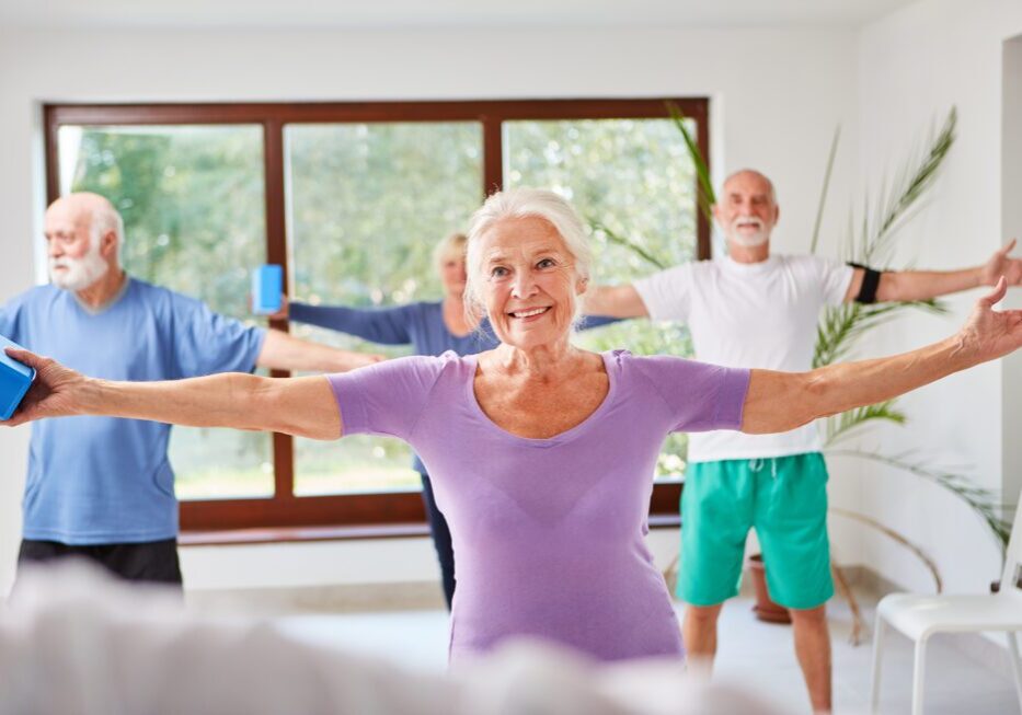 Seniors exercising with hand weights